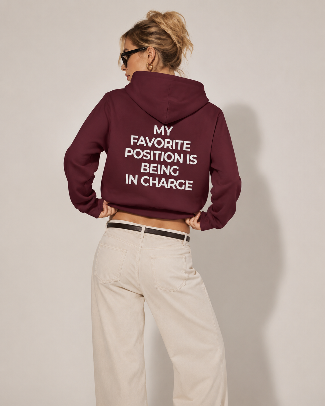 Burgundy feminist hoodie with cream My Favorite Position Is Being in Charge back print