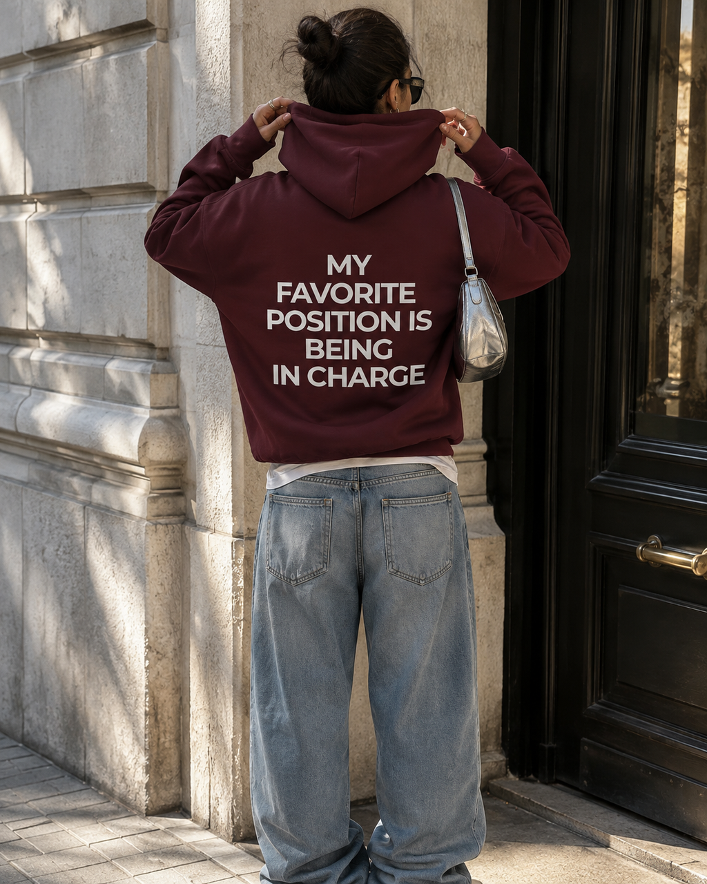 Burgundy feminist hoodie with cream My Favorite Position Is Being in Charge back print