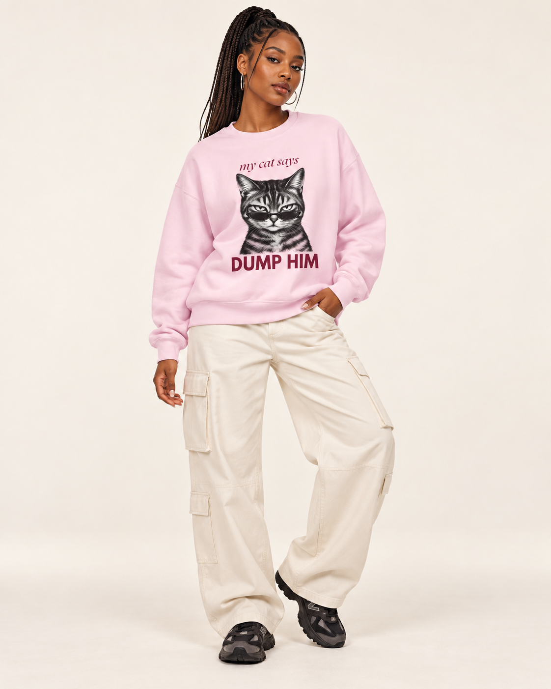 Light pink My Cat Says Dump Him graphic sweatshirt styled with white trousers
