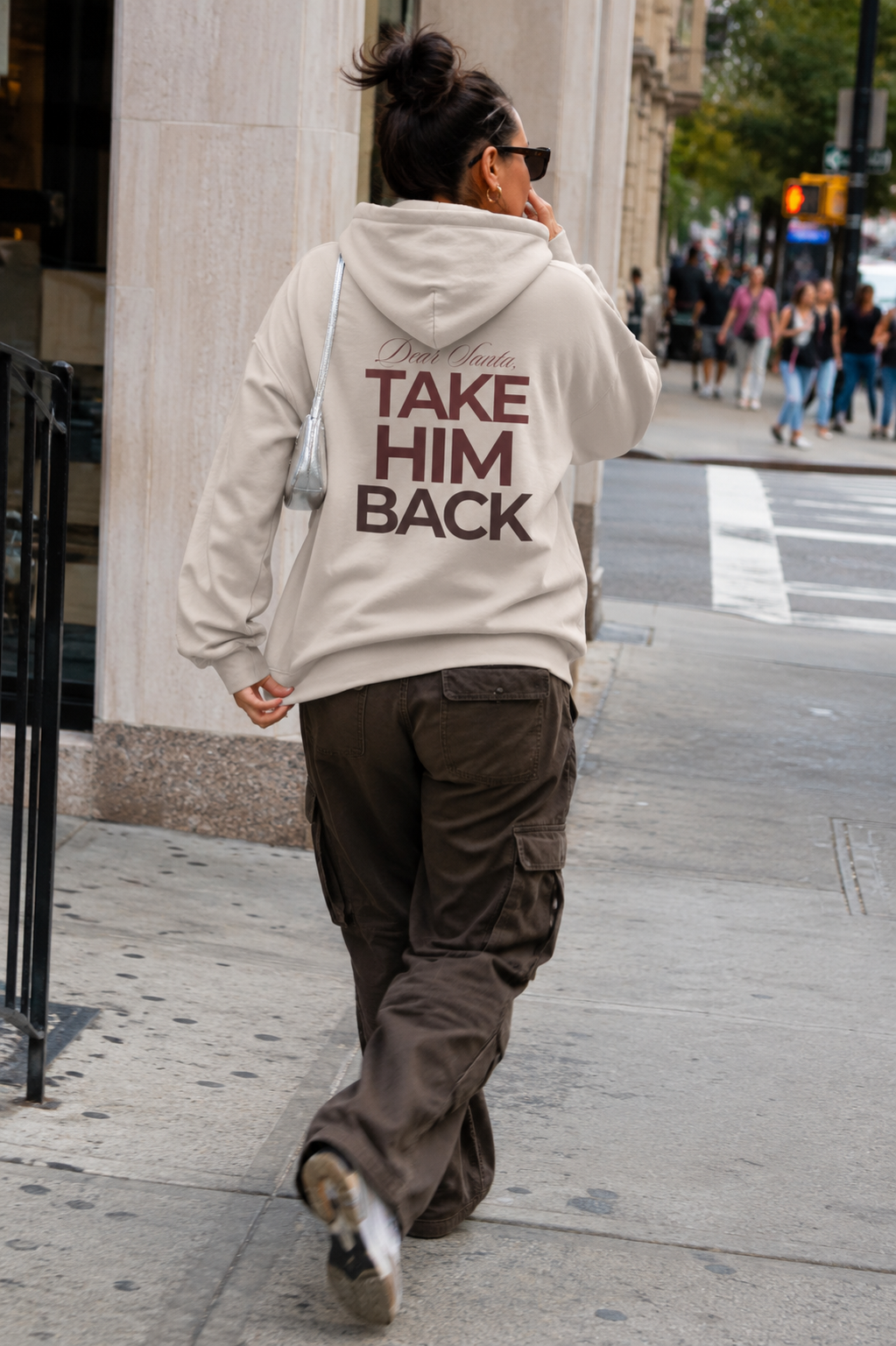 Street-style photo of a cream Dear Santa Take Him Back graphic hoodie