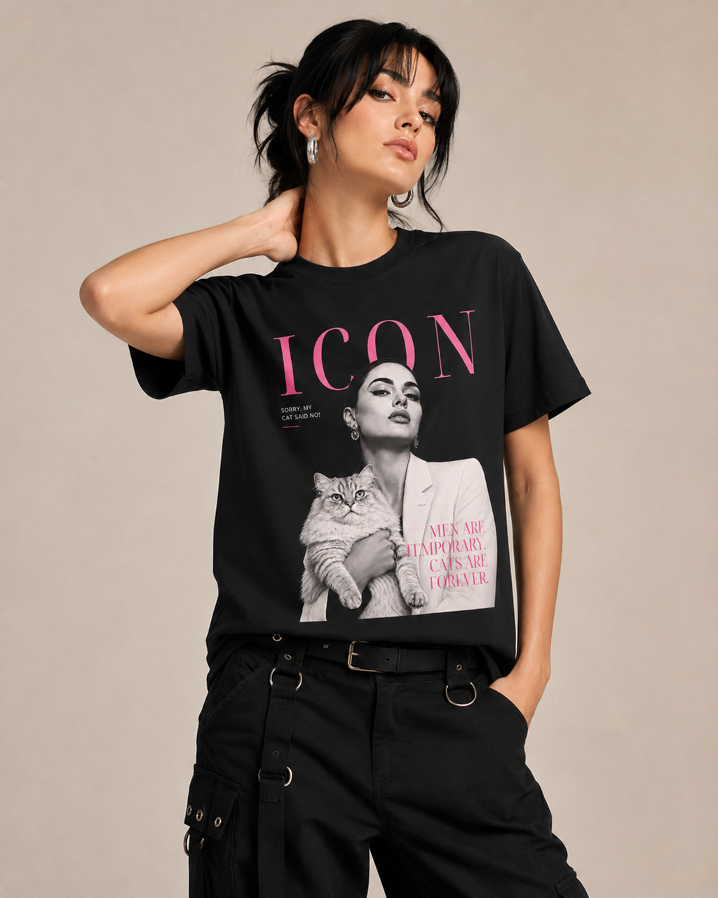 Woman wearing a black editorial cat graphic T-shirt featuring the phrase Men Are Temporary Cats Are Forever.